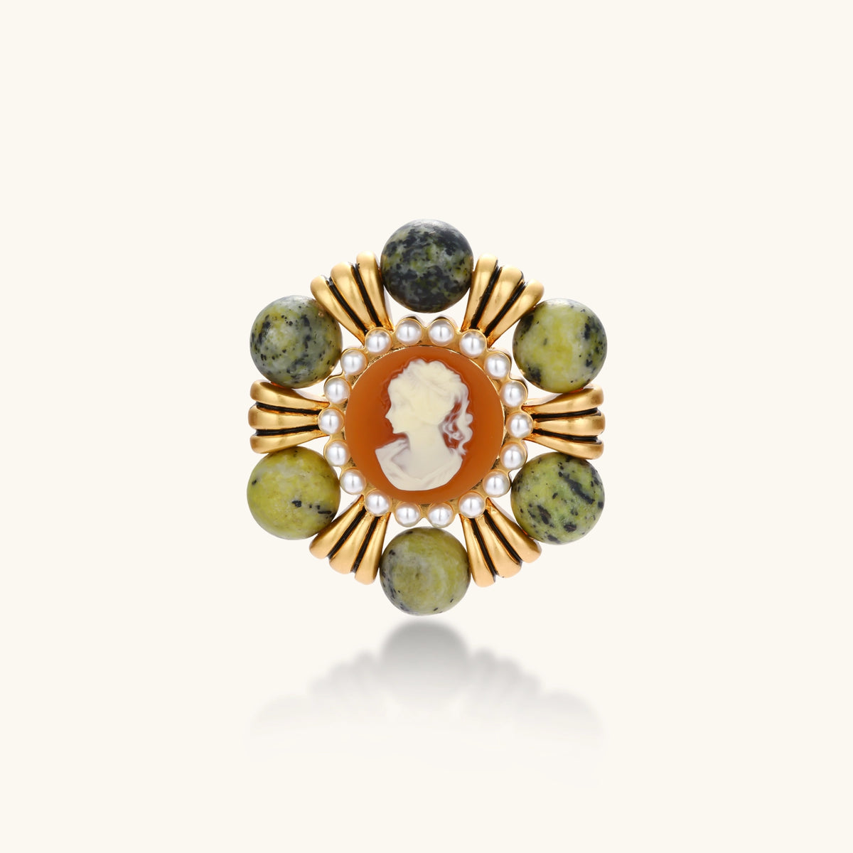 Vintage-style gold plated brooch with a cameo portrait, white bead border and six round green natural stone beads.